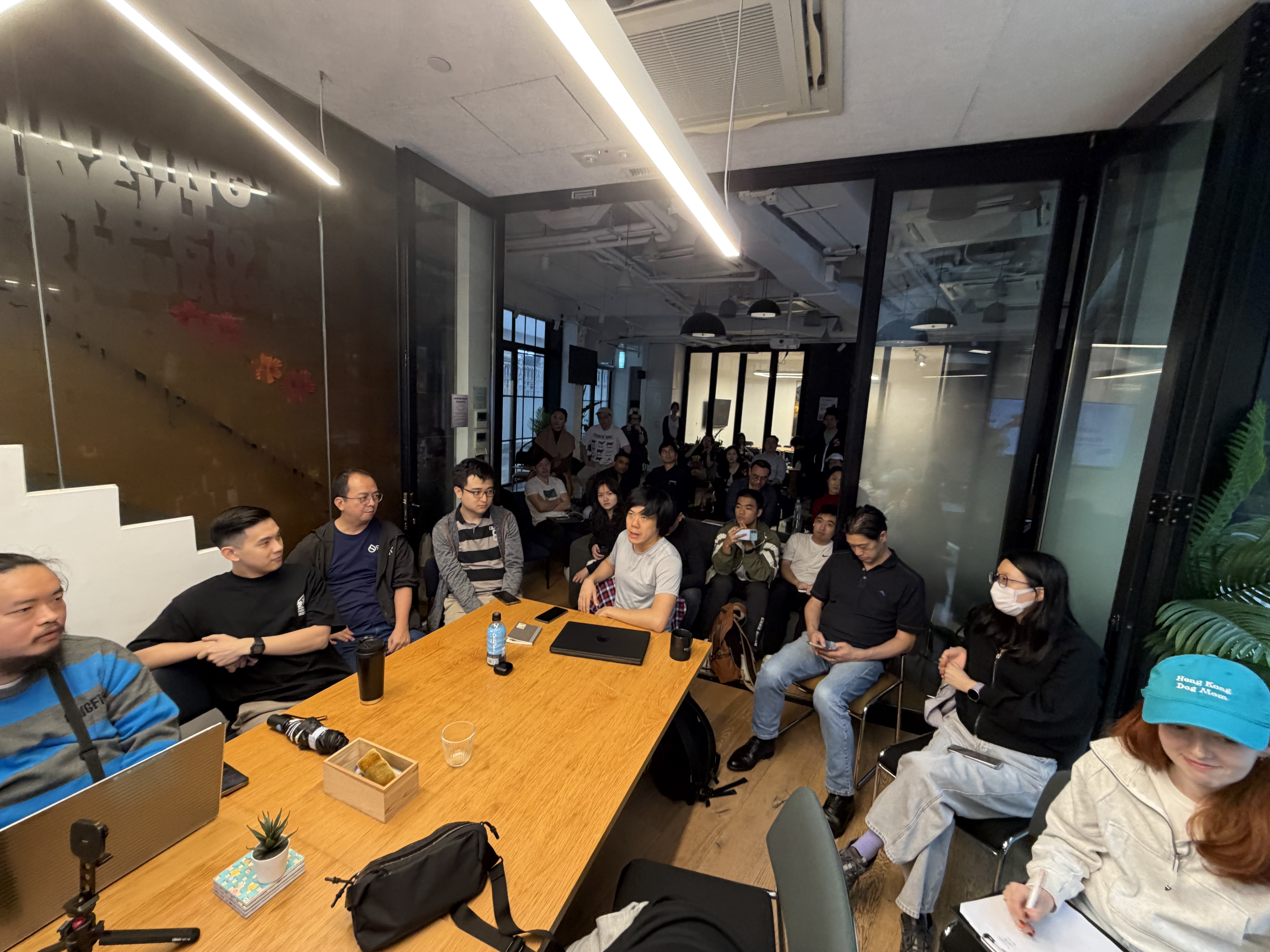 Wide angle shot of 25+ attendees at the CLAW BITES meetup