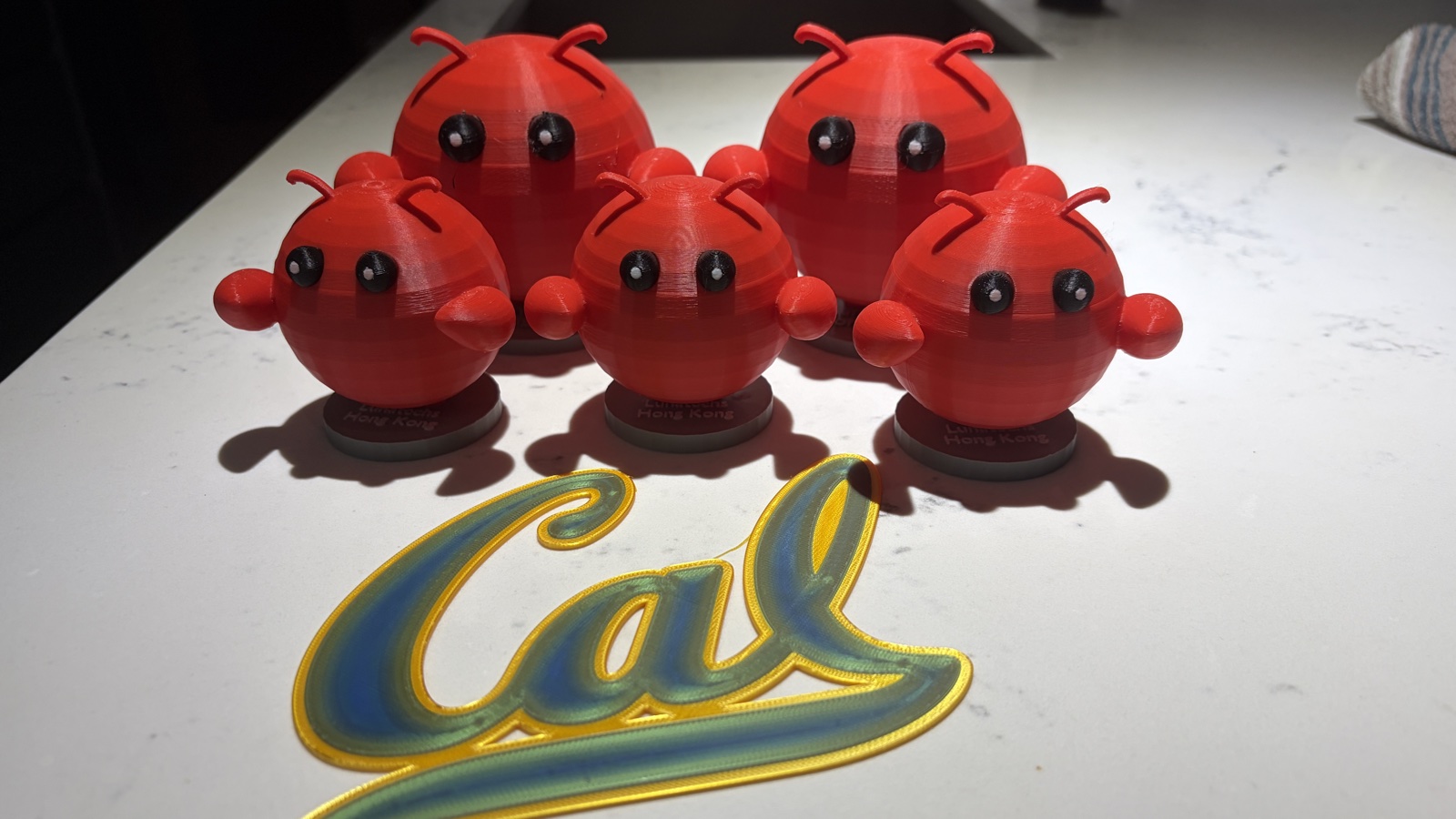 OpenClaw mascots and 3D-printed Cal logo