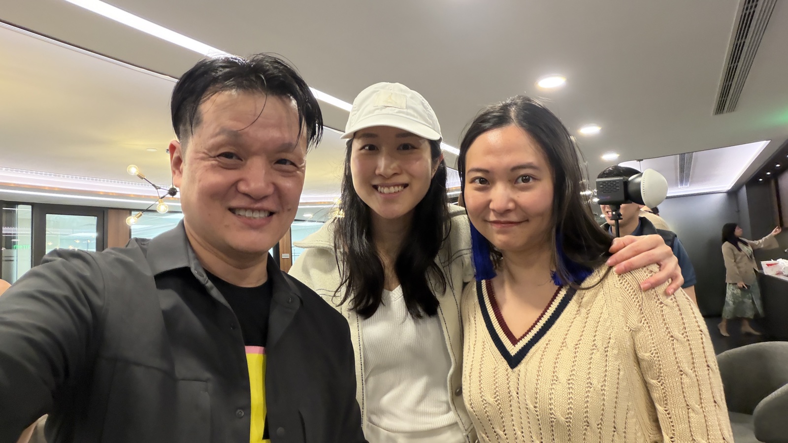 Hanley with two women attendees at the event